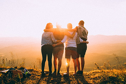 Group of people standing on a hill